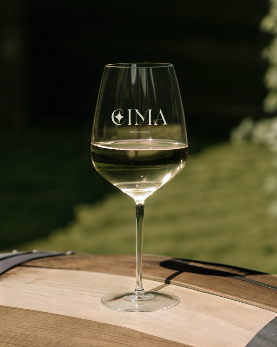 EIMA — etched stemware on an oak barrel