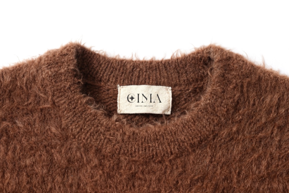 EIMA — woven label on a mohair knit