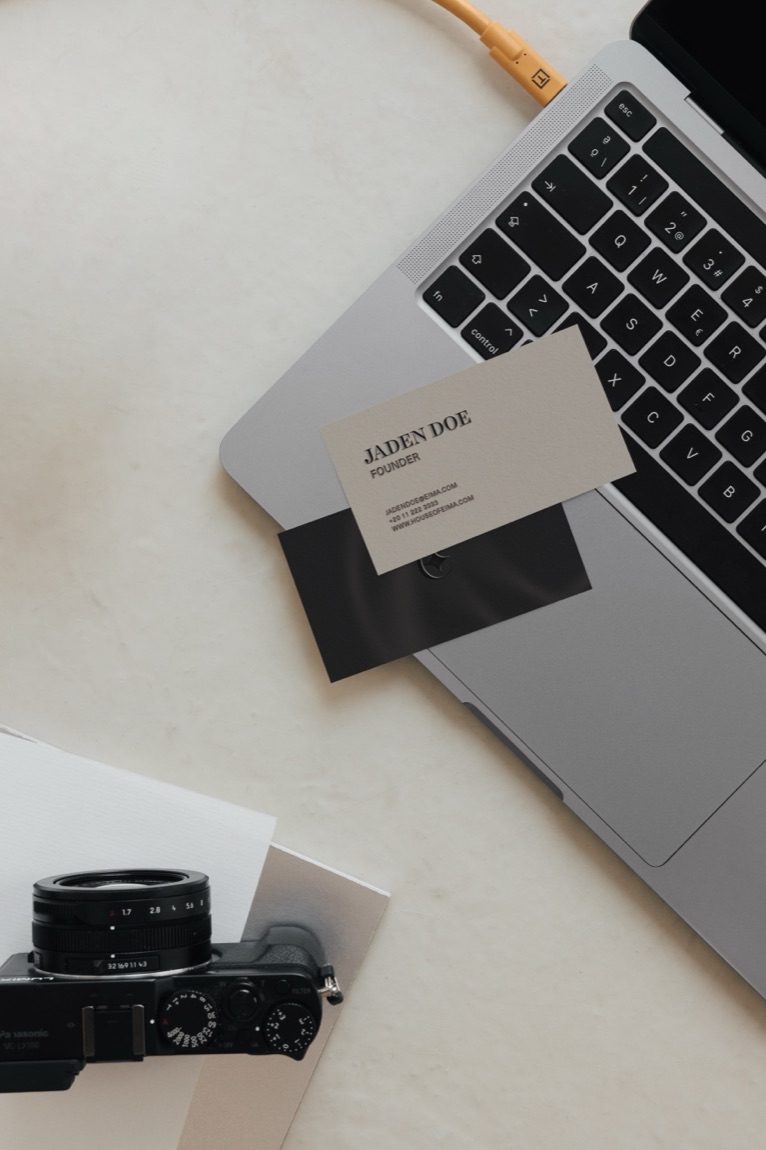 EIMA — flatlay: camera, letterhead, shoes