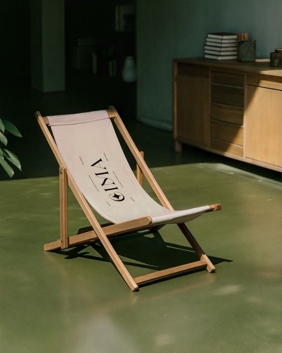 EIMA — branded deck chair in a green room