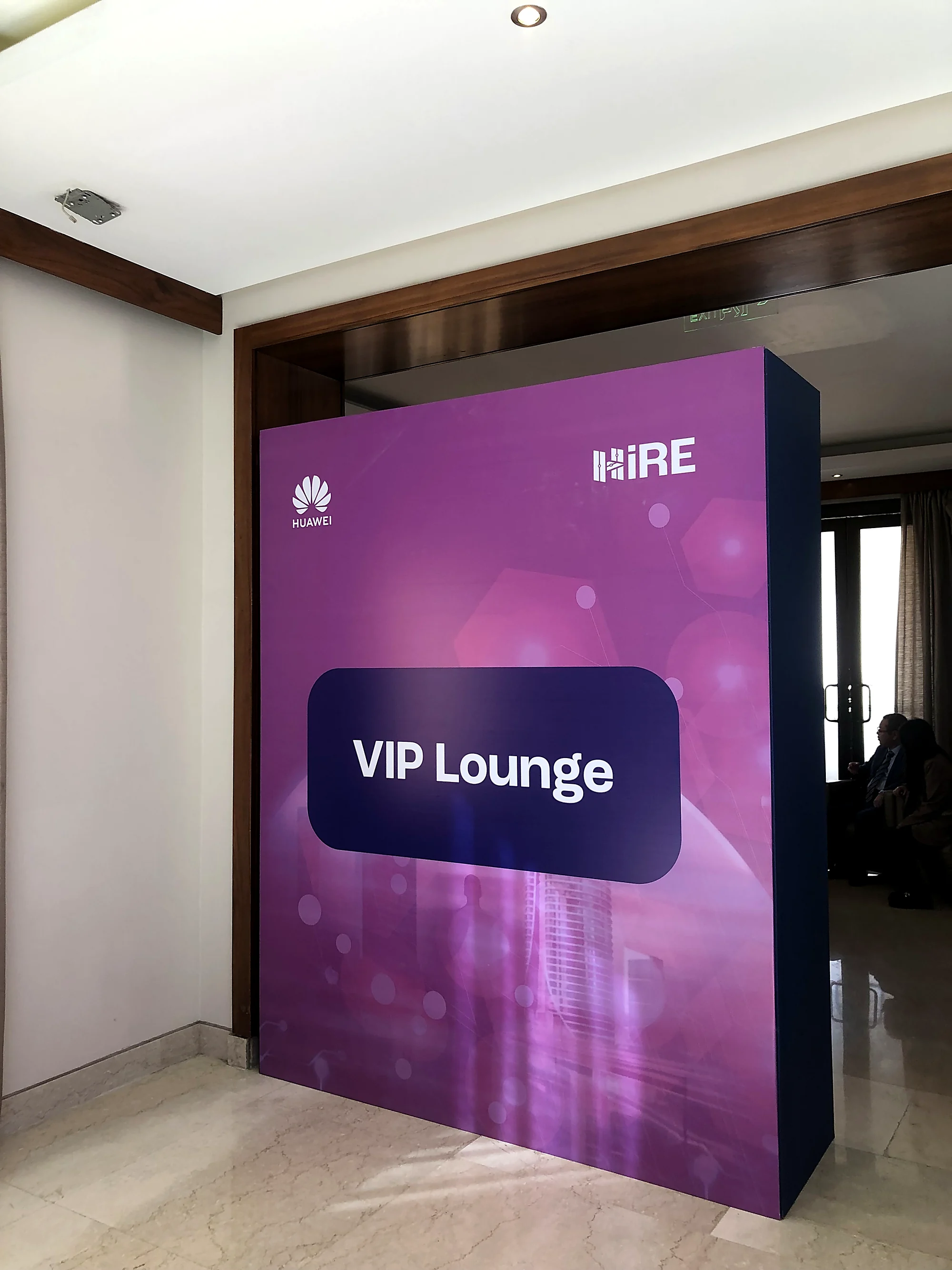 The VIP Lounge entrance, a purple Huawei and HiRE branded wall