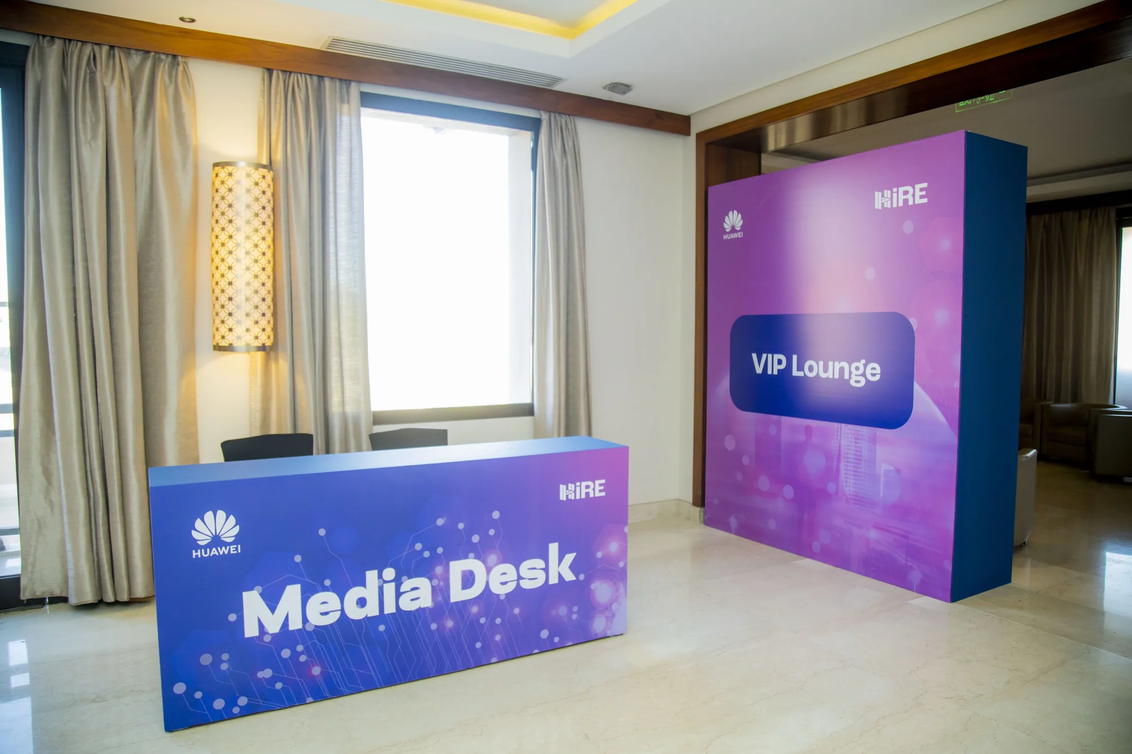 The media desk, built, the terrace beyond the glass