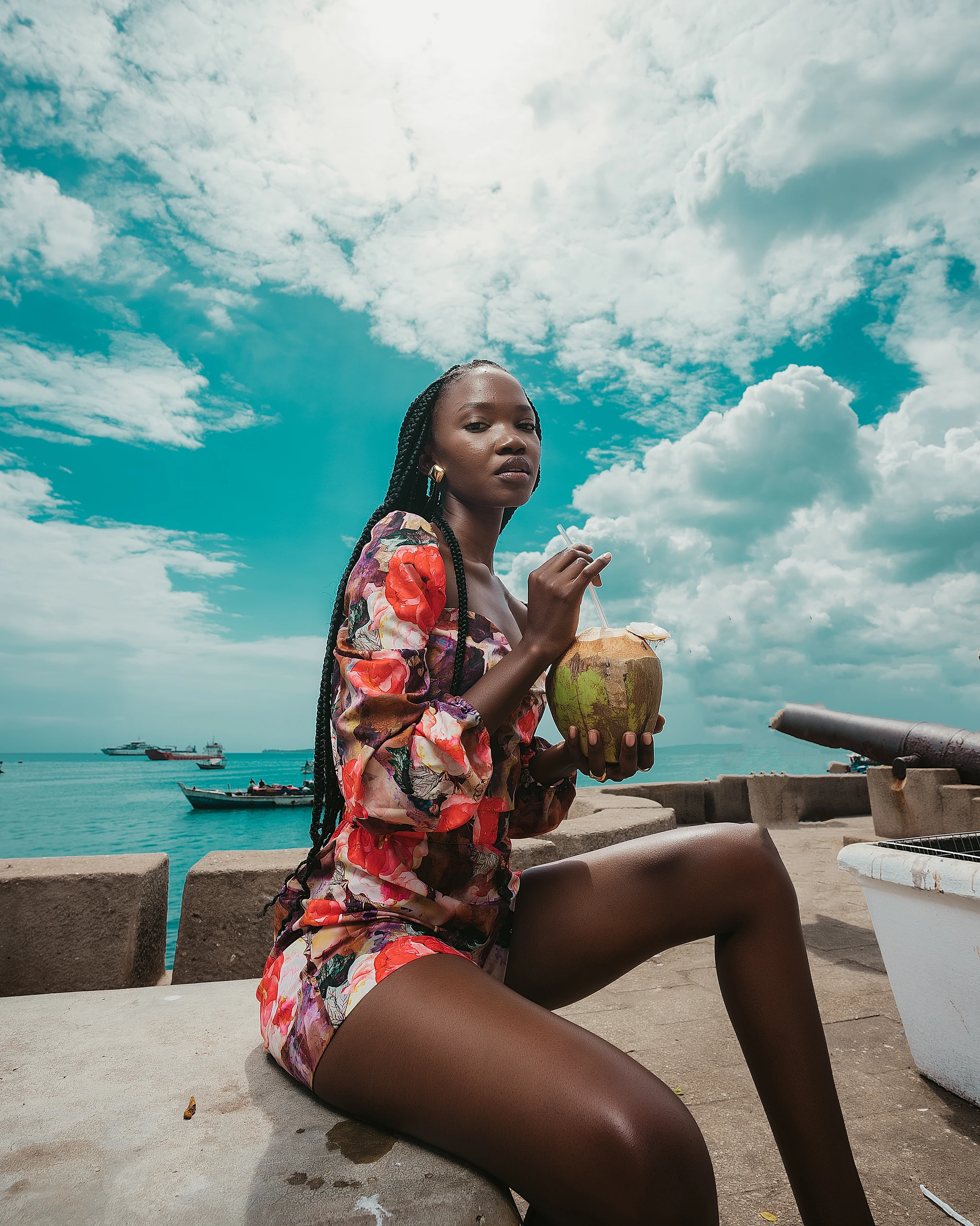 Khokha — a floral kimono on the quay under a bright tropical sky, Zanzibar