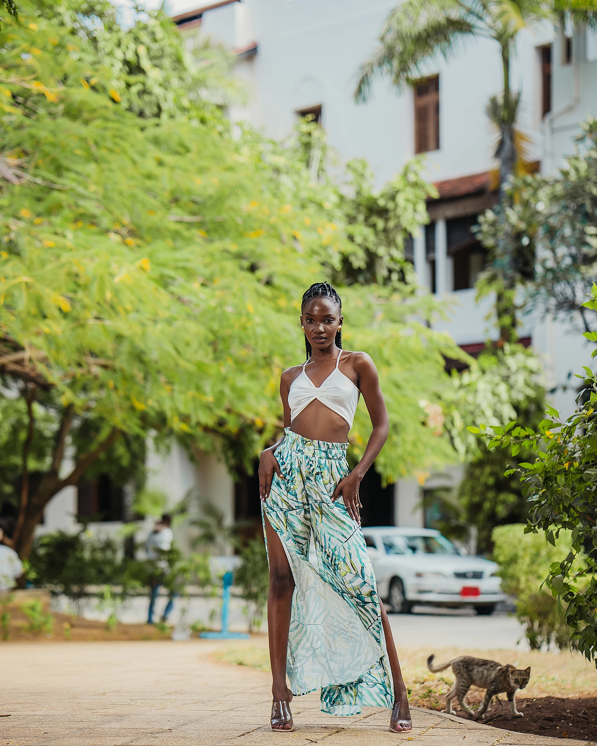 Khokha — a halter and printed wrap skirt under green courtyard trees, Zanzibar