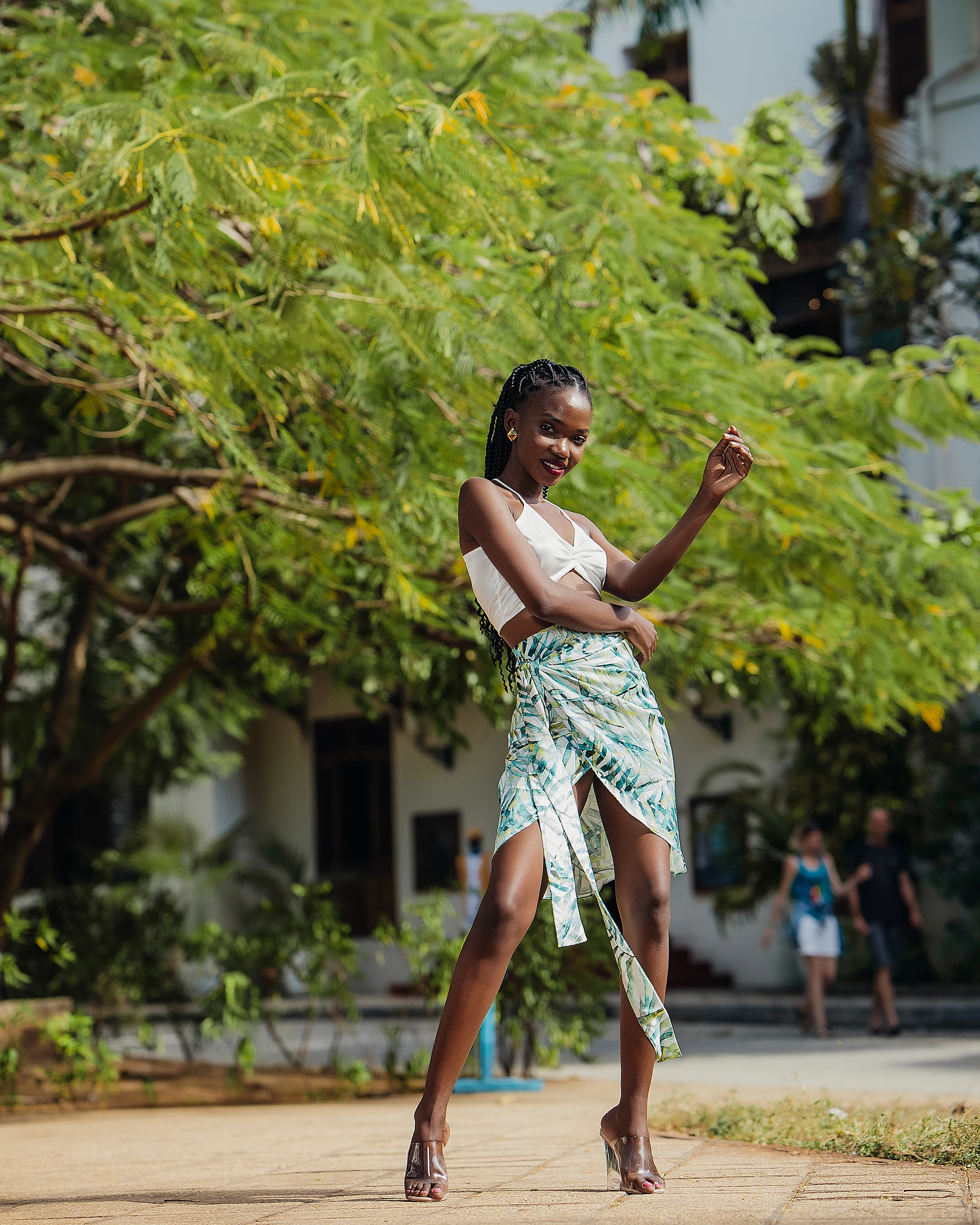 Khokha — mid-stride in dappled courtyard light, Zanzibar