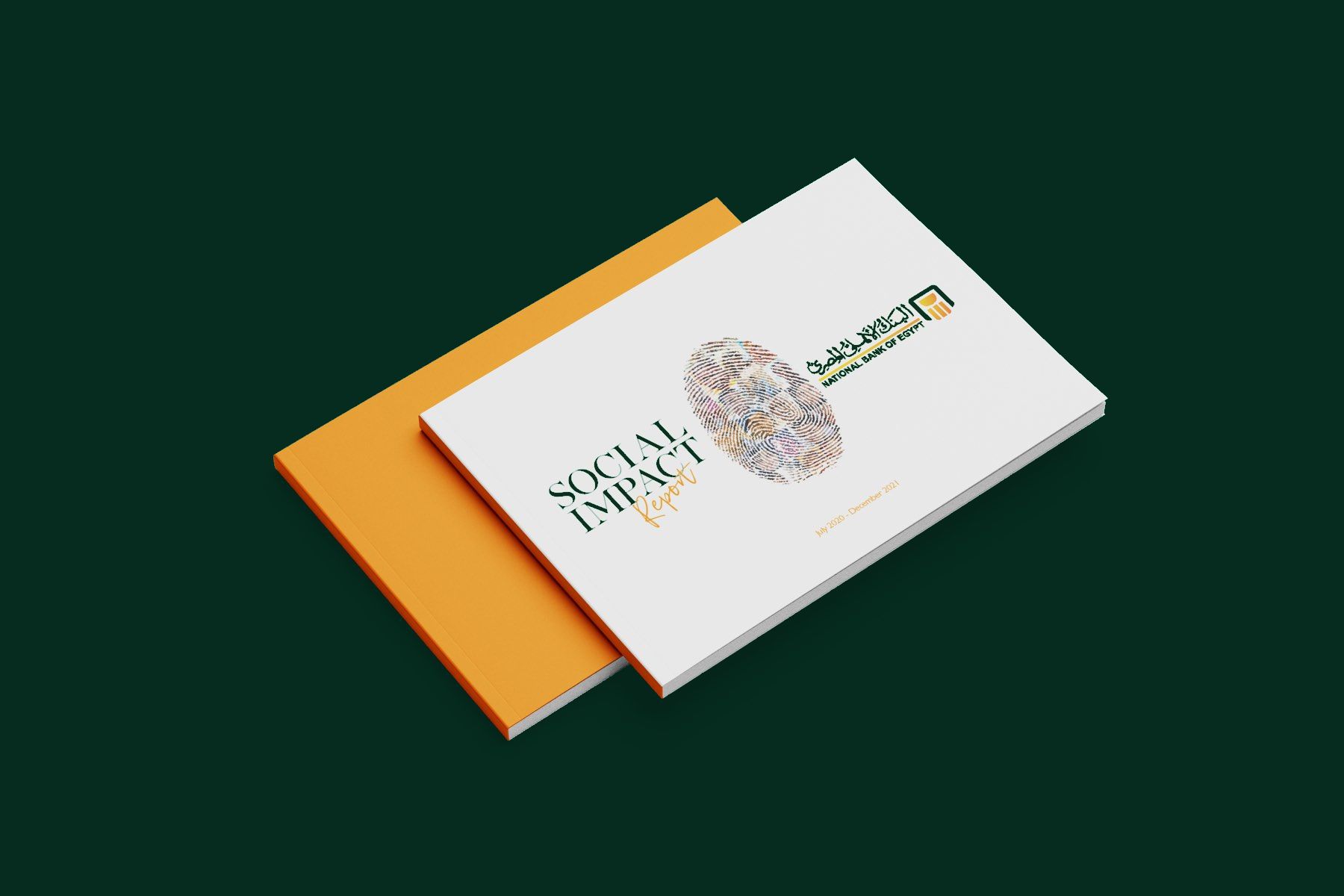 The printed report — the cover and orange inner stacked, on the bank's green